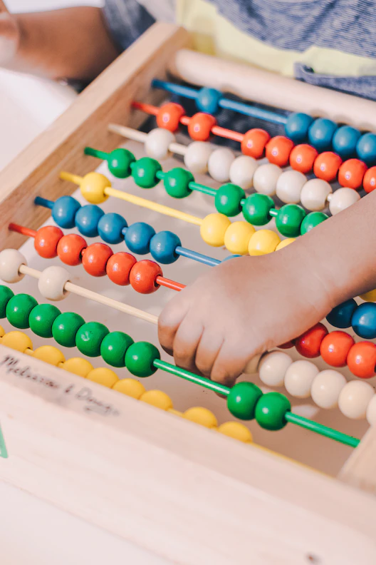 Child plays with abacus